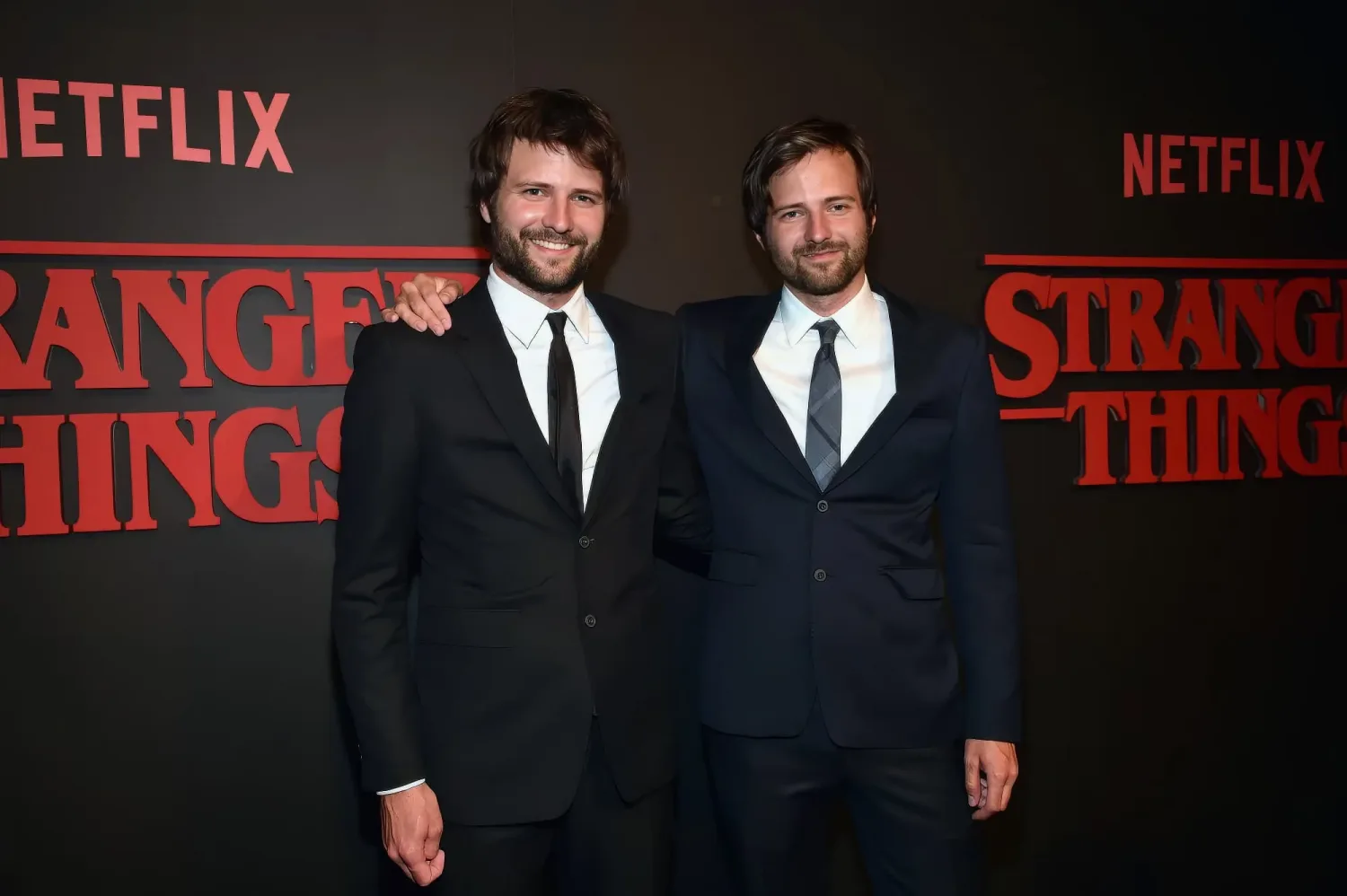 Matt and Ross Duffer, creators of Stranger Things, photographed together at a media event