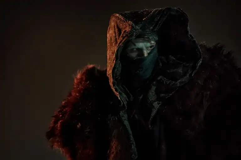 Jacob Elordi as the Creature in Guillermo del Toro’s Frankenstein, wearing a hooded cloak in the 2025 Netflix film.