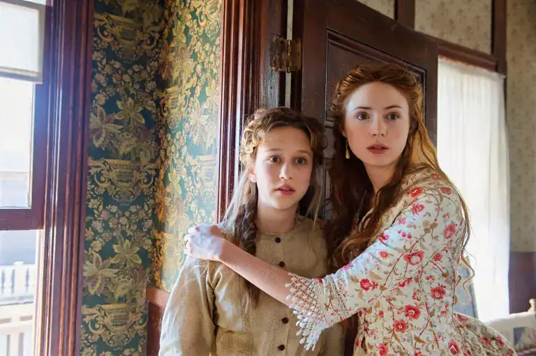 Karen Gillan, cast as Heather MacLeod in the Highlander reboot, pictured in a period drama scene, highlighting her return to Scottish roots.