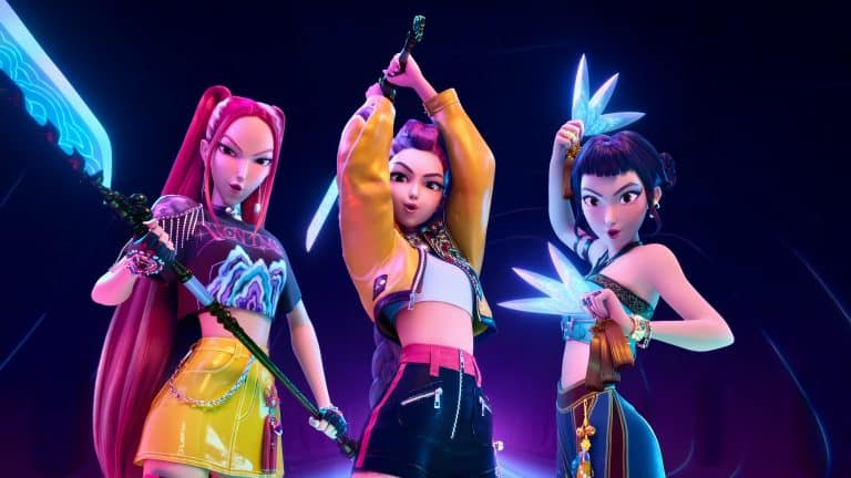 Three fierce K-pop demon hunters wield glowing weapons in a dynamic battle pose, showcasing vibrant outfits and bold expressions from Netflix’s animated film K-pop Demon Hunters.