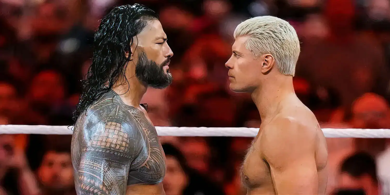 WWE superstars Roman Reigns and Cody Rhodes face off in the ring, both cast in the new Street Fighter movie with Reigns playing Akuma and Rhodes playing Guile.